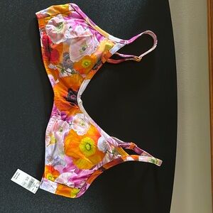 Aerie swimwear top in orange multi colors with adjustable back and straps.